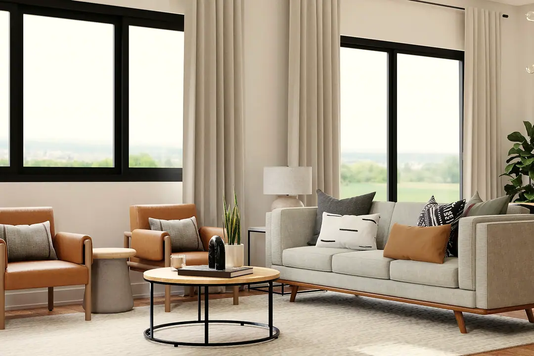 Salón con sofá gris y grandes ventanas